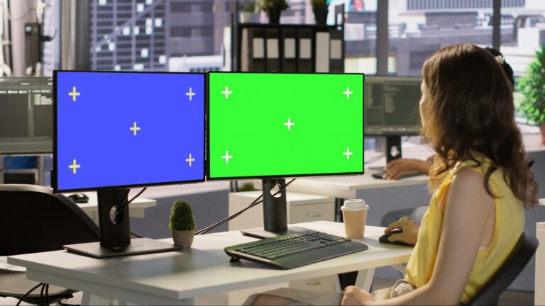 Office setup with dual monitors used for managing digital signage content in Malaysia